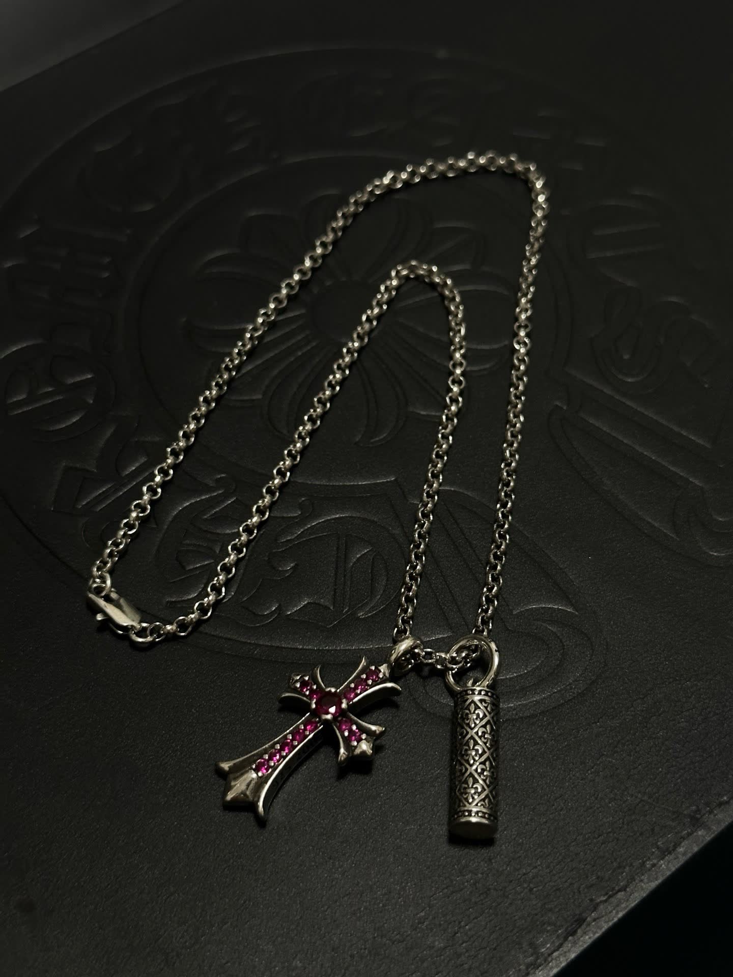 Chrome Hearts Silver Cross Pendant with Ruby Accents and cylindrical charm
